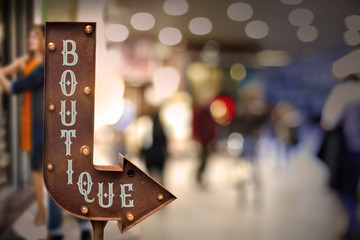 Boutique title signboard, in front of the store . Retro style
