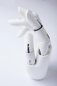 The concept of a prosthetic hand on a white background, vertically.