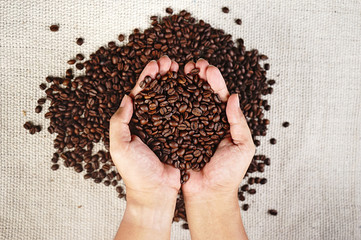 Top view hand with coffee bean 