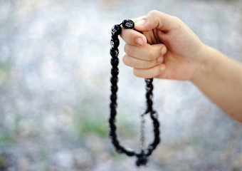 Muslim Woman hand with rosary