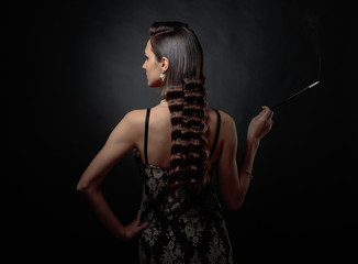 Portrait of a beautiful woman with long mouthpiece .