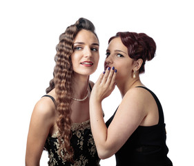 Two young women whispering gossip on white background.