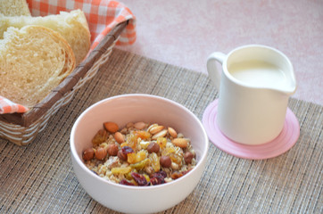 Healthy Breakfast: oatmeal, muesli, dried fruit, milk, crispy bread top view