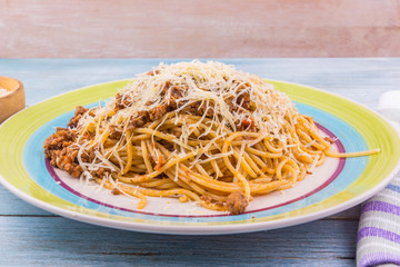 Spaghetti bolognese with cheese close up