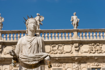Fototapeta na wymiar Statue of Madonna Verona - Piazza delle Erbe Italy