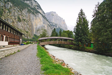mountain landscape with a bridge and a river, Switzerland