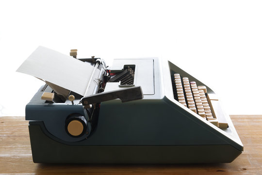 Isolated typewriter against a white background. Empty copy space for Editor's text.