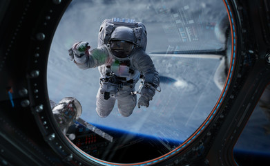 Astronaut working on a space station 3D rendering elements of this image furnished by NASA - Powered by Adobe