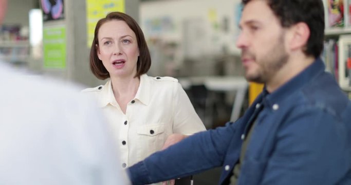 Mid adult female executive in a meeting