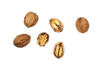 Cracked walnuts isolated on white background, top view