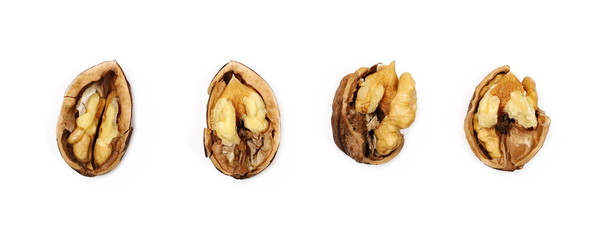 Cracked walnuts isolated on white background, top view