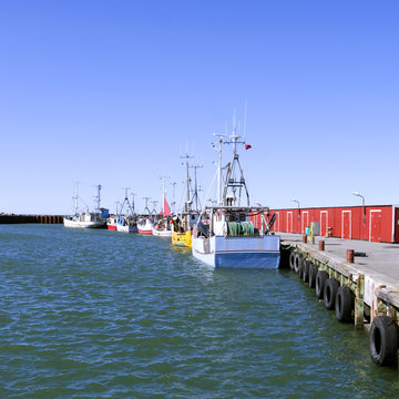 Laesoe / Denmark: Fishing cutters moored at the pier in the fishing port of Oesterby Havn