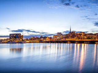 Stockholm sunset skyline with City Hall as seen from Riddarholmen.