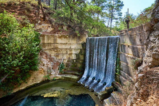 Fototapeta Waterfall in Epta piges park at Rhodes island, Greece