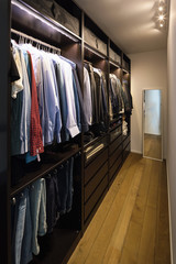 Walk-in closet full of clothes