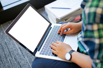 close up asian student work on notebook mobile device at outdoor of department store.	
