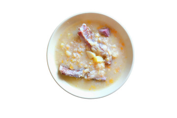 pea soup with smoked meat isolated on white
