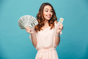 Portrait of a satisfied beautiful girl wearing dress