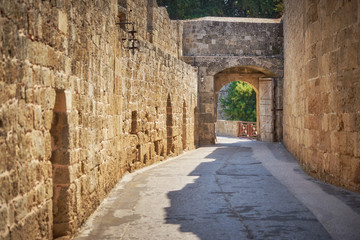Fototapeta na wymiar One of the gates to the old Rhodes city through the defensive walls