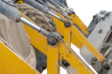 part of modern yellow excavator machines isolated on white