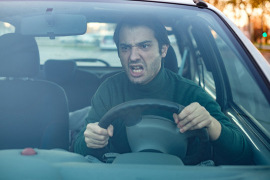 Angry Man Driver Pissed Off By Drivers In Front Of Him And Gesturing With Hands