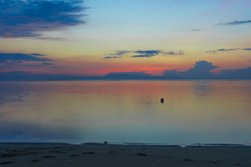 Beautiful sunrise on a calm beach in Bali
