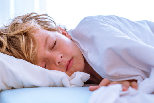 Sick little kid in bed