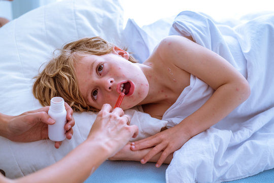 Sick little kid in bed