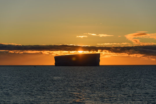 Tabular iceberg at sunset