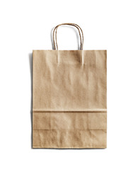 Blank craft paper bag on white background. Responsive design mockup. Isolated with clipping path.