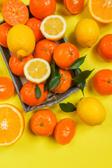 Fresh citrus fruits background flat lay, healthy lifestyle vegetarian organic antioxidant detox diet beverage. Tropical summer assortment grapefruit, orange, lemon,tangerines