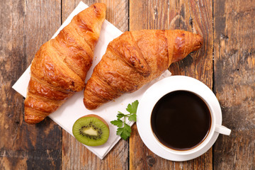 coffee cup and croissant