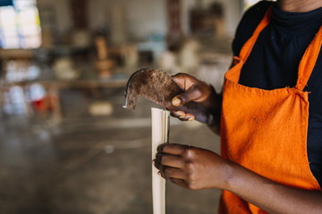 person working with bamboo in Rwanda, Africa