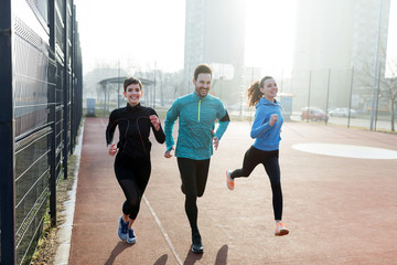 Friends fitness training together outdoors living active healthy