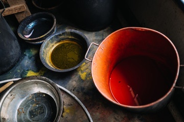 Fototapeta na wymiar buckets of paint in a workshop