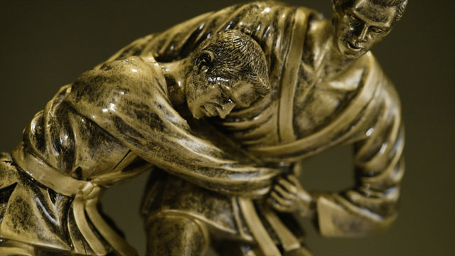 Cup for a victory in the judo championship. Cup for sporting achievement . The trophy represents two people in sparring - Powered by Adobe