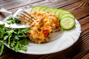 Pork chop with cheese and red pepper 