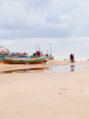 Fototapeta premium hammamet-Tunisia-city beach with people and boats in the fall