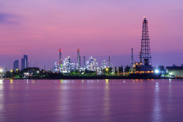 Oil refinery at the river in sunrise time / Big Factory in sunrise time