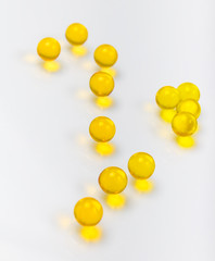 Fish oil capsules on a white background