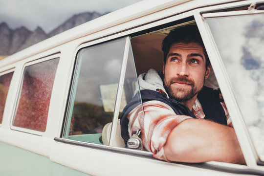 Handsome Guy Driving A Minivan