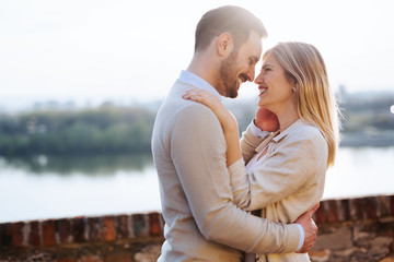 Fototapeta premium Happy couple in love hugging outdoor