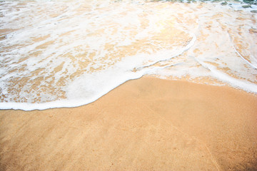 Fototapeta na wymiar ocean wave on sandy beach 