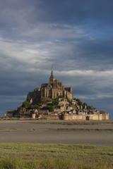 Dramatic view of the majestic Mont Saint Michel abbey at low tide in Normandy, France