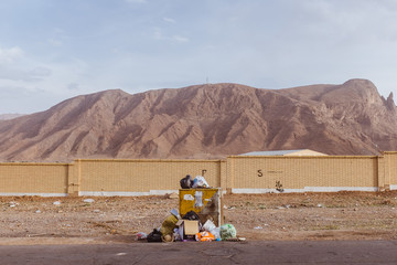 Pile of trash in front of the mountains near Yazd, Iran