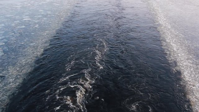 ferry road way from the waves and ice on the sea surface after the ship. 