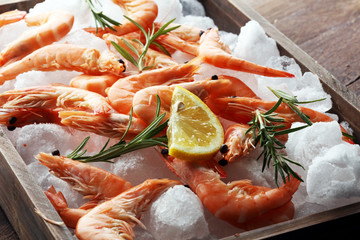 Raw fresh Prawns Langostino Austral. shrimp seafood with lemon and spices.