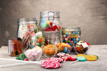 candies with jelly and sugar. colorful array of different childs sweets and treats.