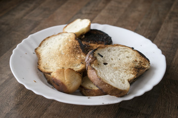 Fried white bread. Burned during cooking.