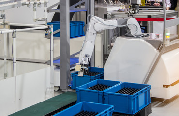  Industry 4.0 Robot concept .The robot arm is working smartly in the production department, the future factory.